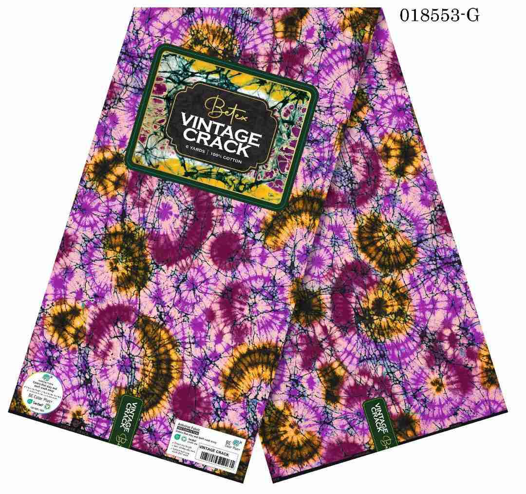 Betex Vintage Crack Ankara fabric with magenta and amber tie-dye sunburst pattern, 100% cotton premium wax print.