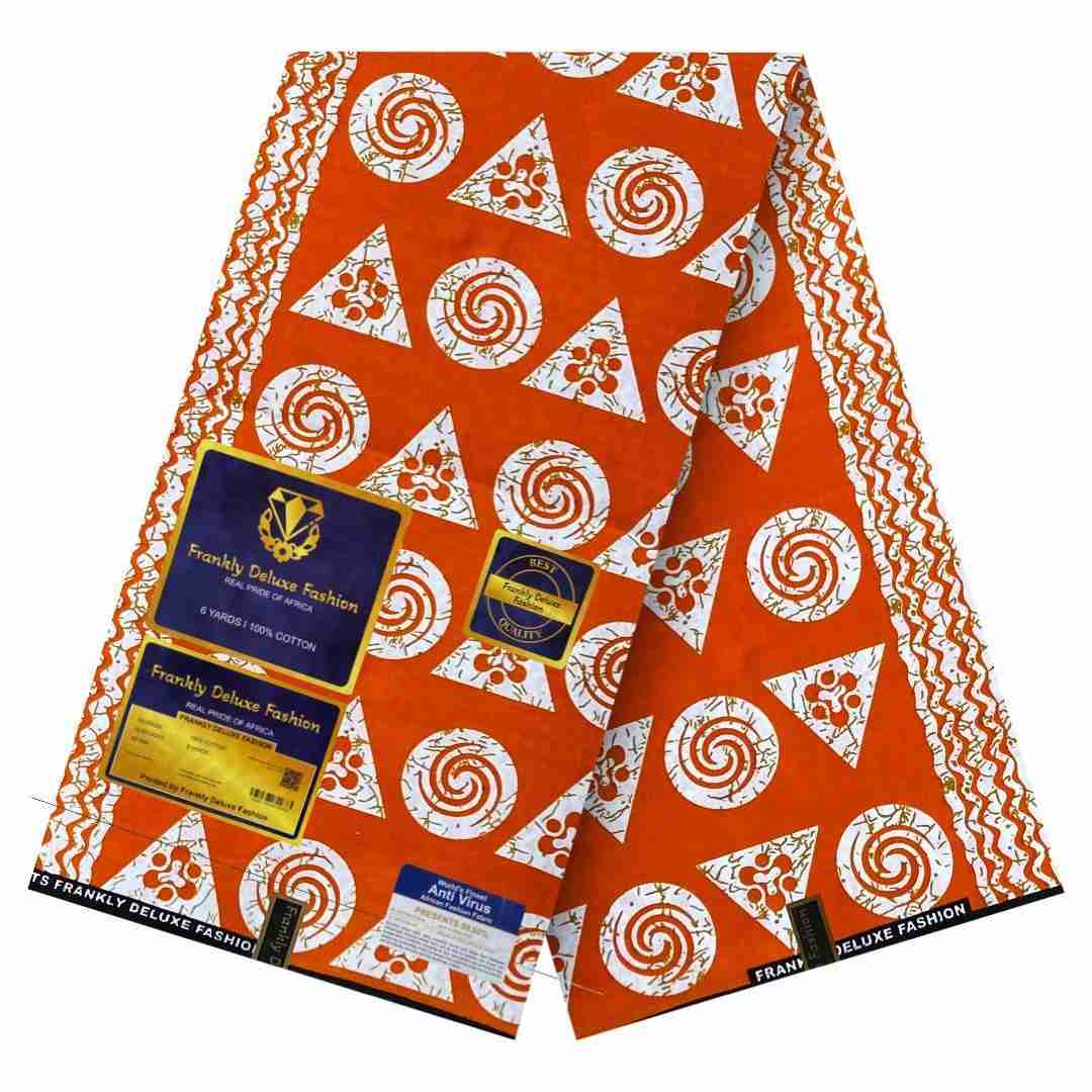Burnt orange Ankara fabric with white geometric circles and triangle patterns by Frankly Deluxe Fashion, 100% cotton premium wax print.”