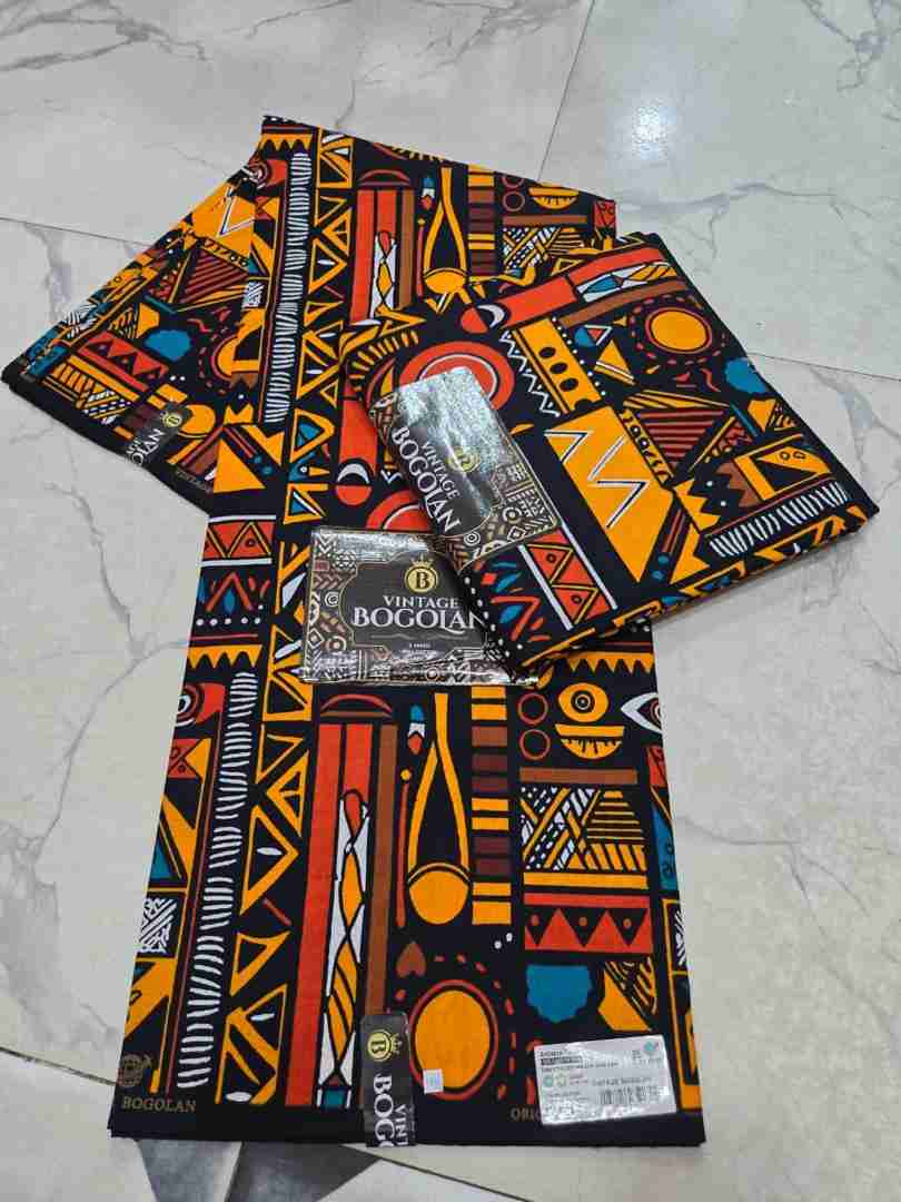 Vintage Bogolan tribal abstract mudcloth pattern Ankara fabric, terracotta and mustard geometric African wax print.