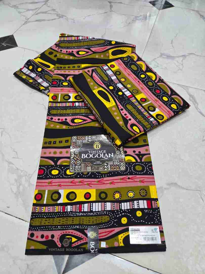 Vintage Bogolan vibrant abstract tribal stripe pattern Ankara fabric, pink and olive green geometric African wax print.